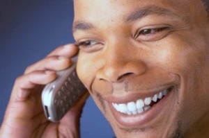 smiling_man_talking_on_cell_phone_111